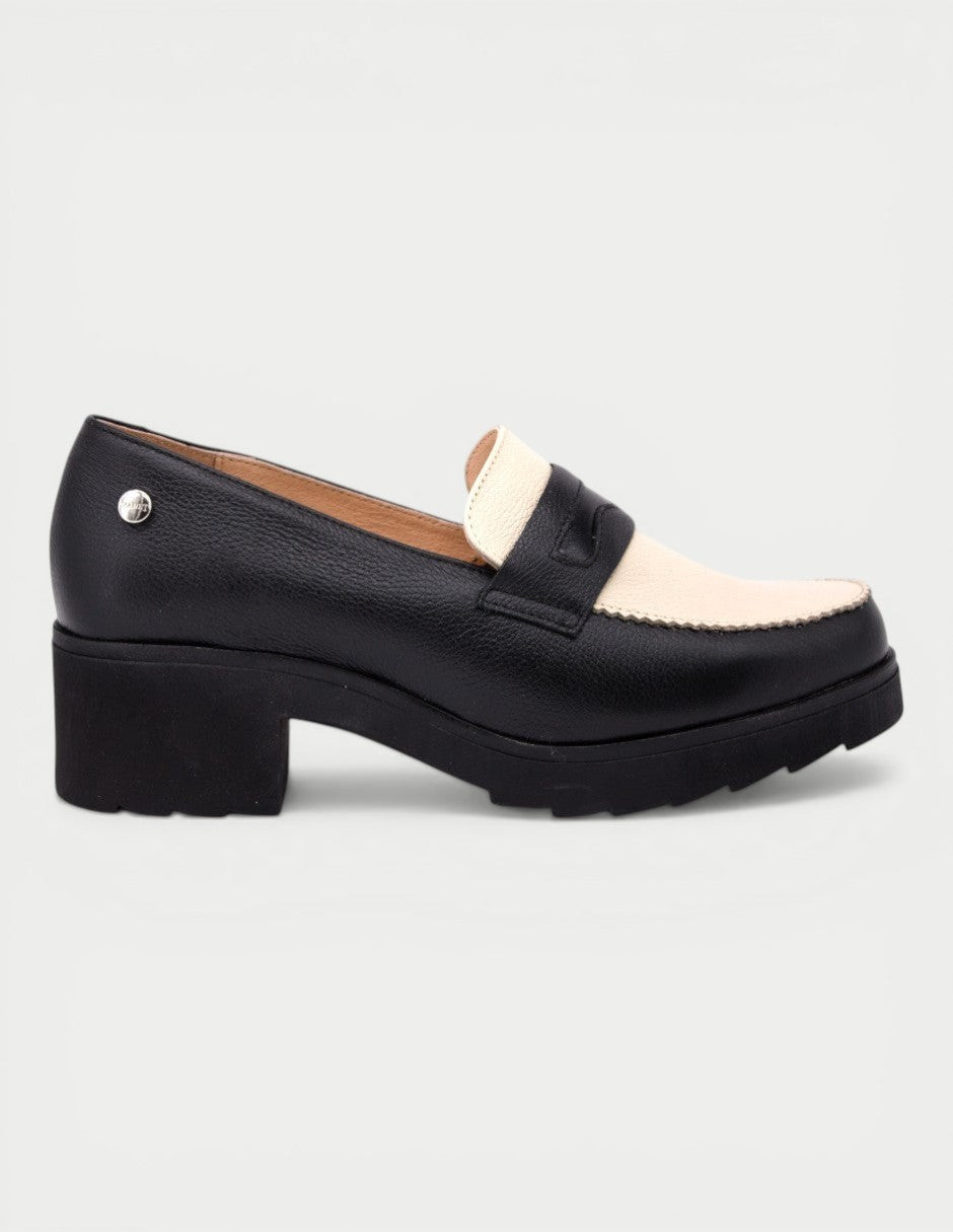 Manet black and cream leather two-tone loafers with a block heel and lug sole. Classic style.