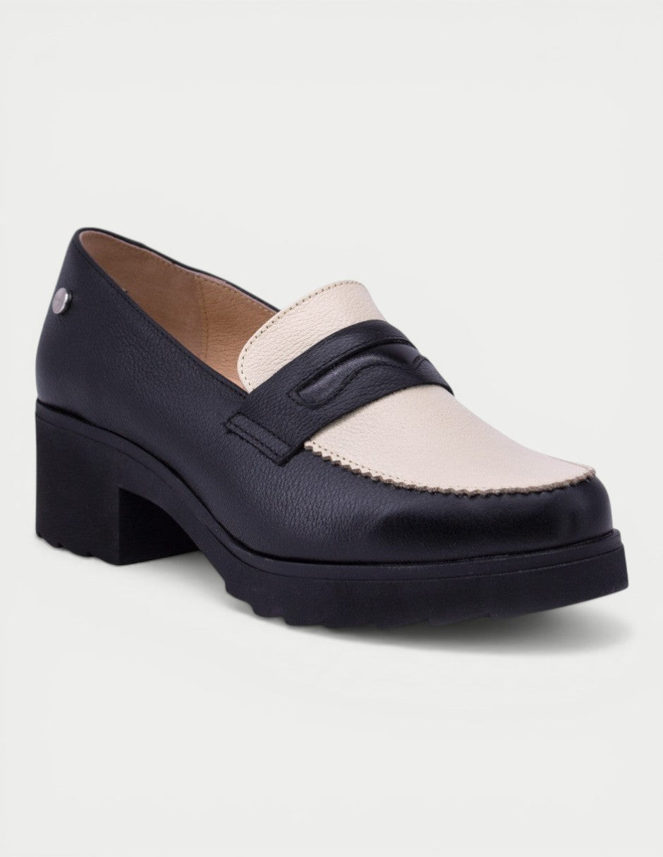 Manet black and cream leather two-tone loafers with a chunky heel and decorative strap.