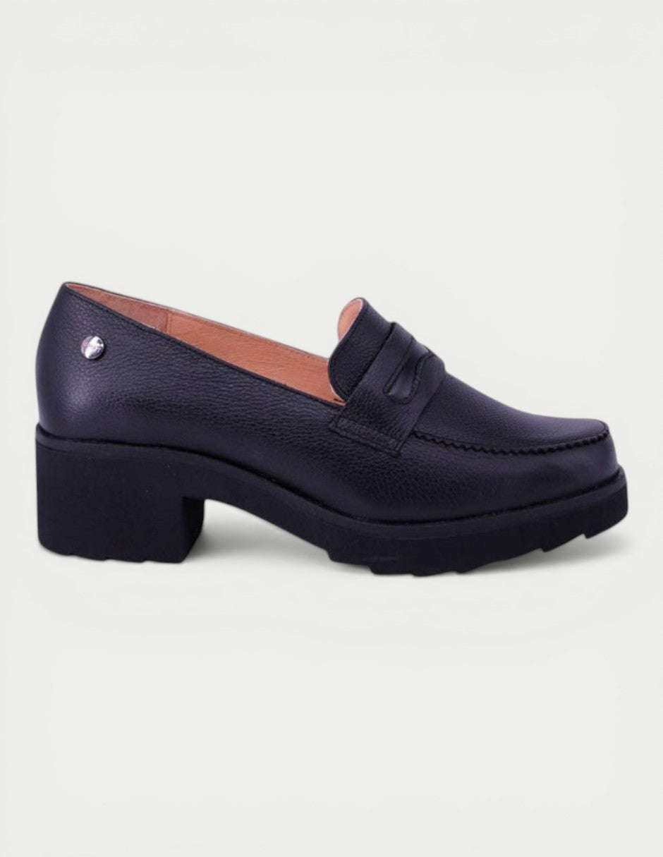 Manet black leather loafer with a block heel and decorative strap. Classic, elegant footwear for women.