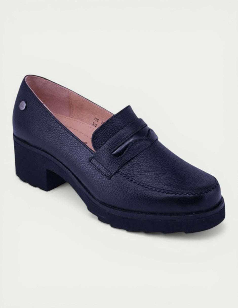 Manet black leather loafer with a block heel and decorative strap detail. Timeless elegance for modern women.
