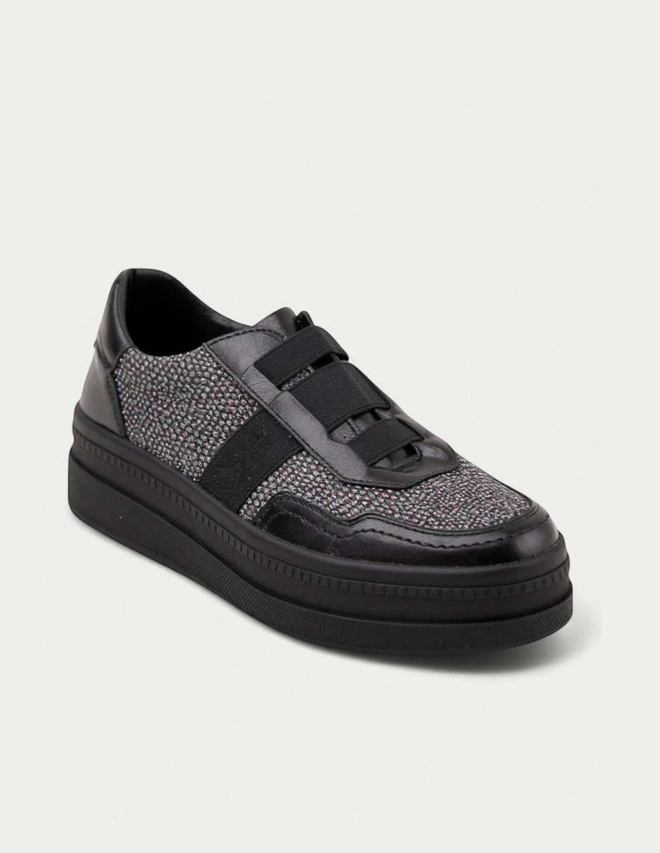 Manet Ema 01 black sneakers with textured fabric, leather accents, elastic straps, and a low platform sole.
