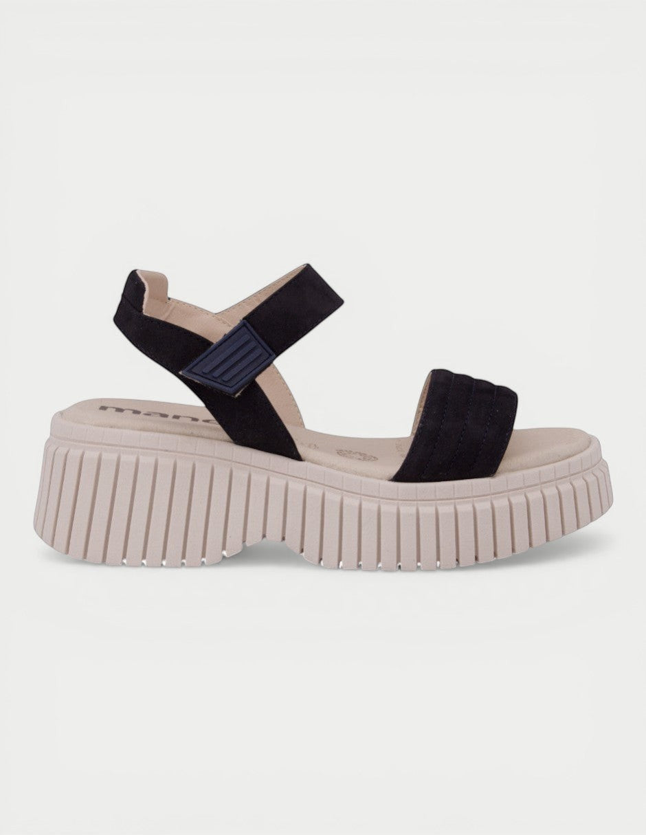Manet black suede platform sandals with adjustable ankle strap and chunky sole.