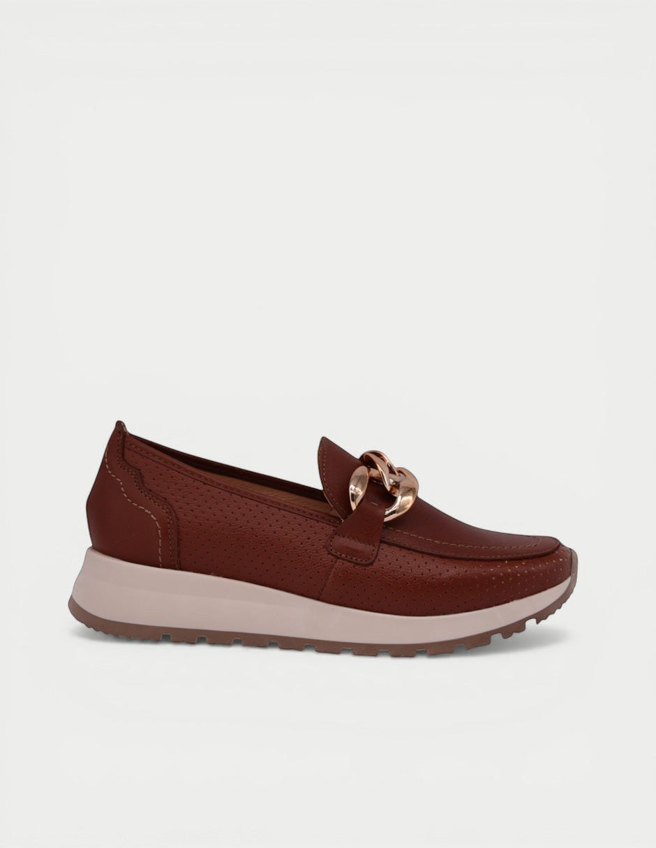 Manet brown leather perforated loafers with elevated sole and gold chain detail. Comfortable and stylish for all-day wear.