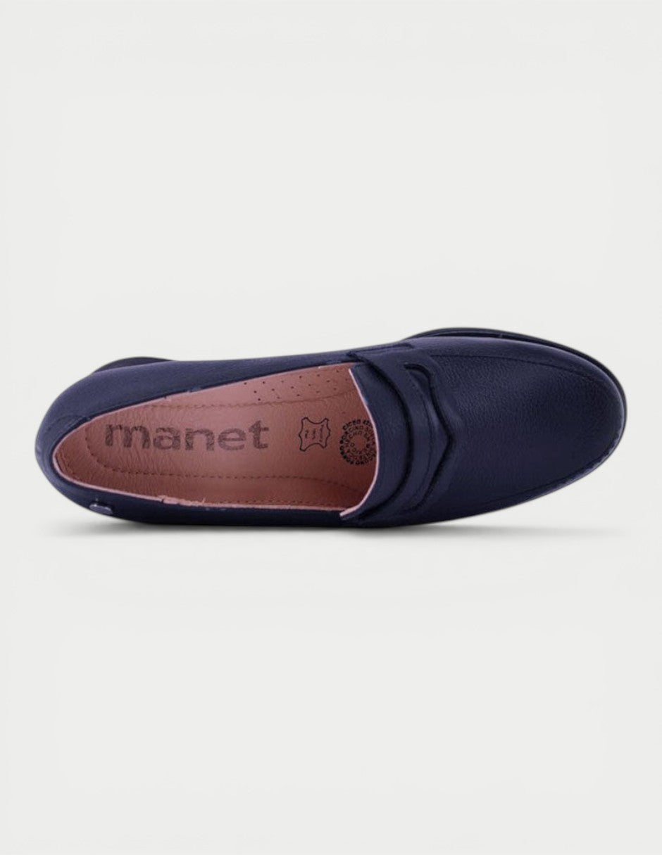 Manet navy blue leather moccasin with a discreet heel and clean, structured silhouette. Perfect for modern women.